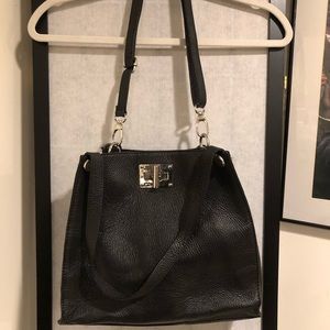 Black purse, faux leather, brand not stated.  Great condition